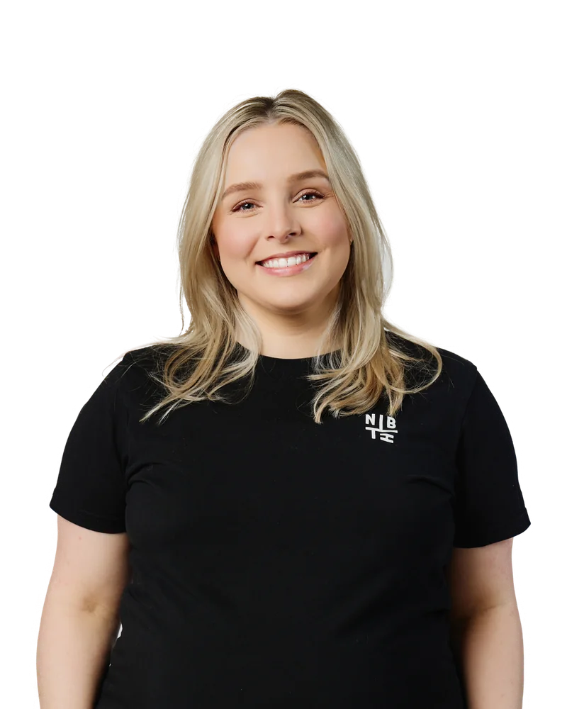 Cassy Woodforth, AI & Digital Strategist at Neighbourhood, in a black NBH tee