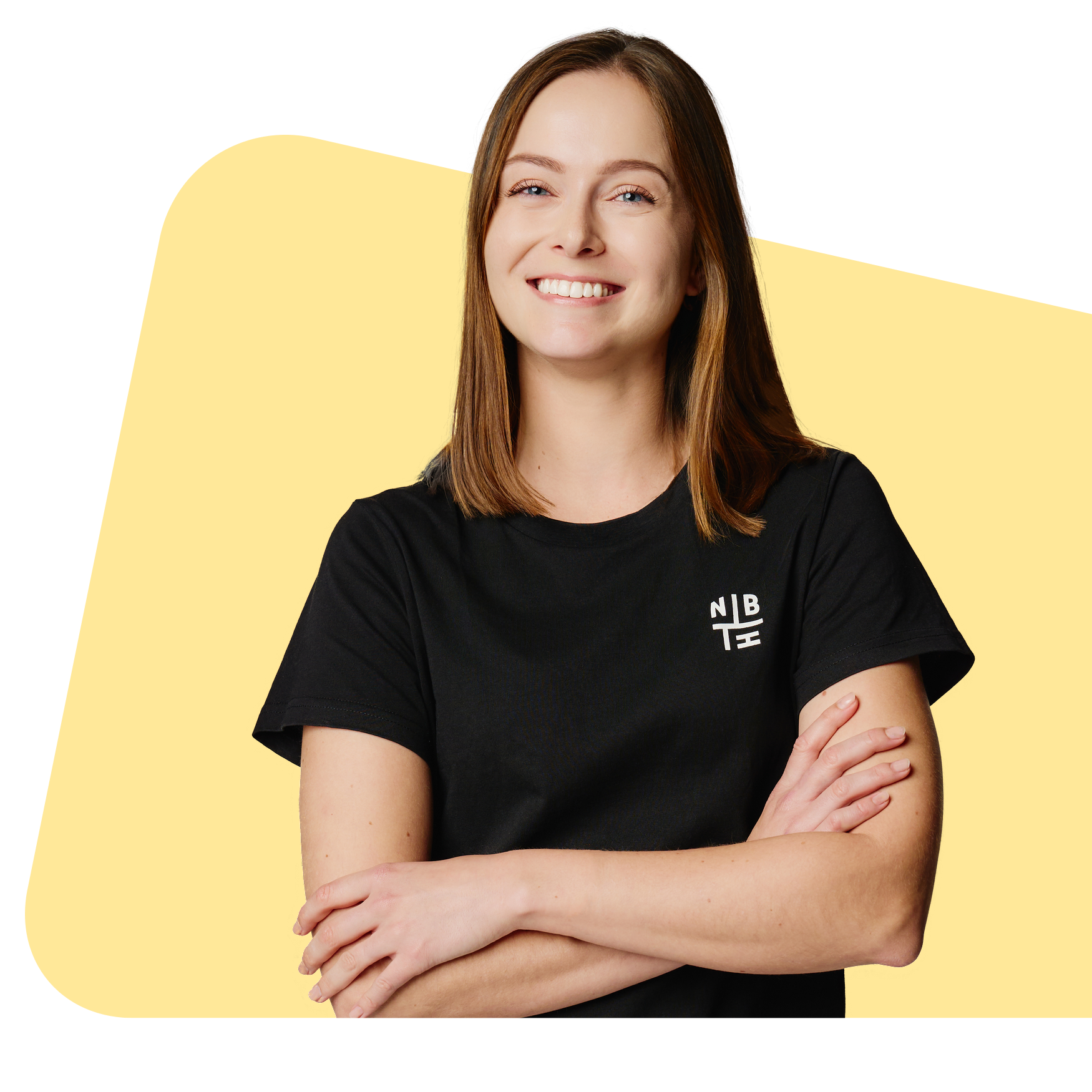 Smiling Neighbourhood team member in a black NBH tee, arms folded, on a soft yellow shape