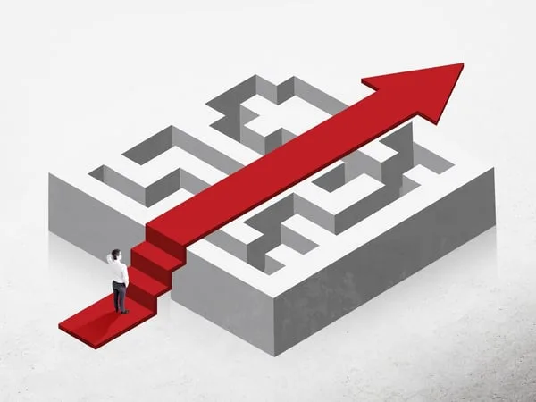 A red arrow taking a direct route straight through a grey maze while a figure climbs its steps