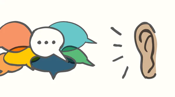 A cluster of speech bubbles beside a listening ear