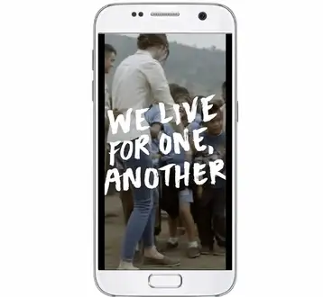 A full screen vertical Stories ad on a phone with hand lettered text over video