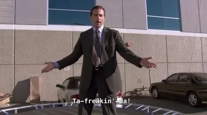 A still from The Office of Michael Scott with his arms spread wide, captioned Ta-freakin-da