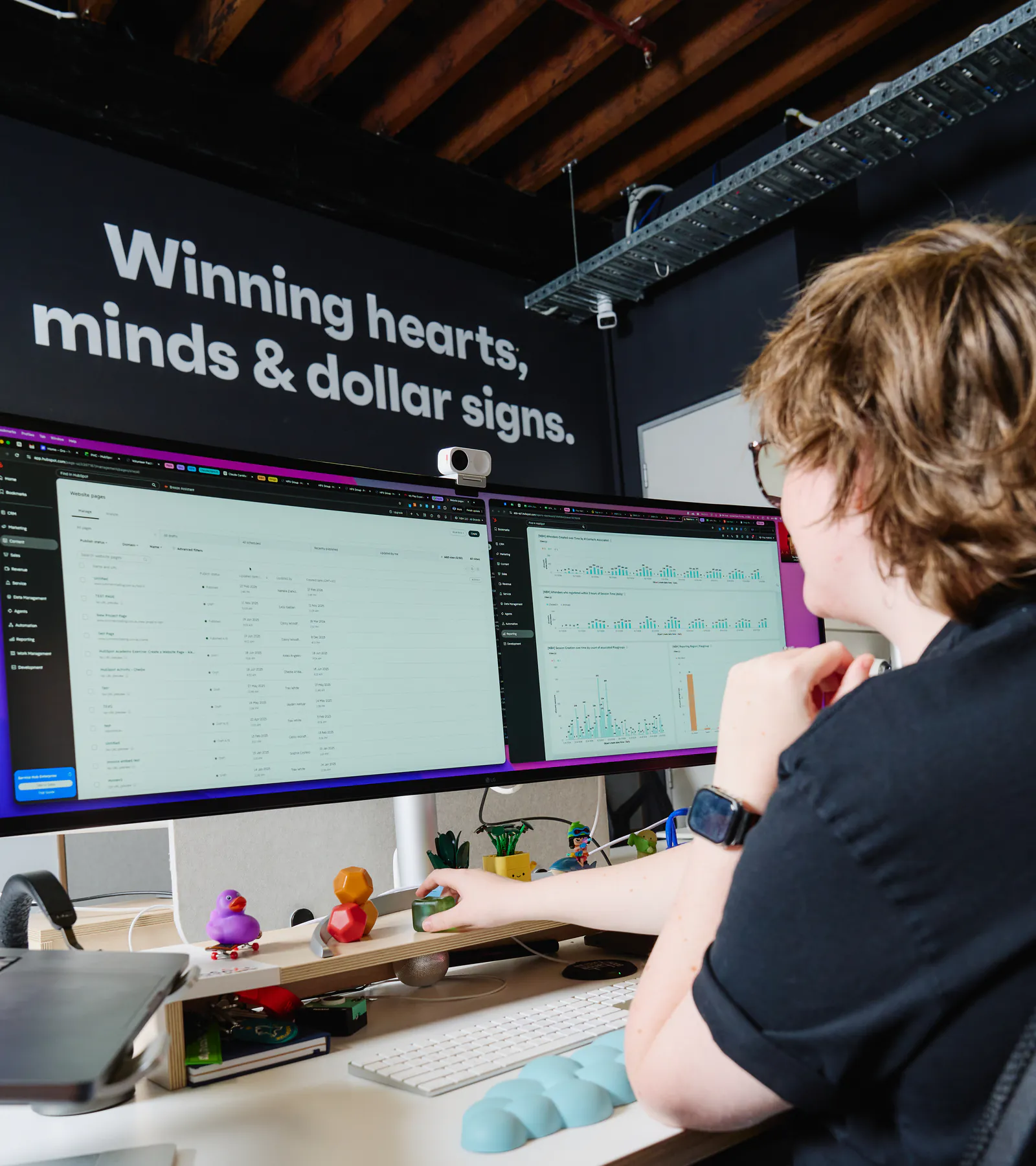 A Neighbourhood engineer working in HubSpot across two monitors