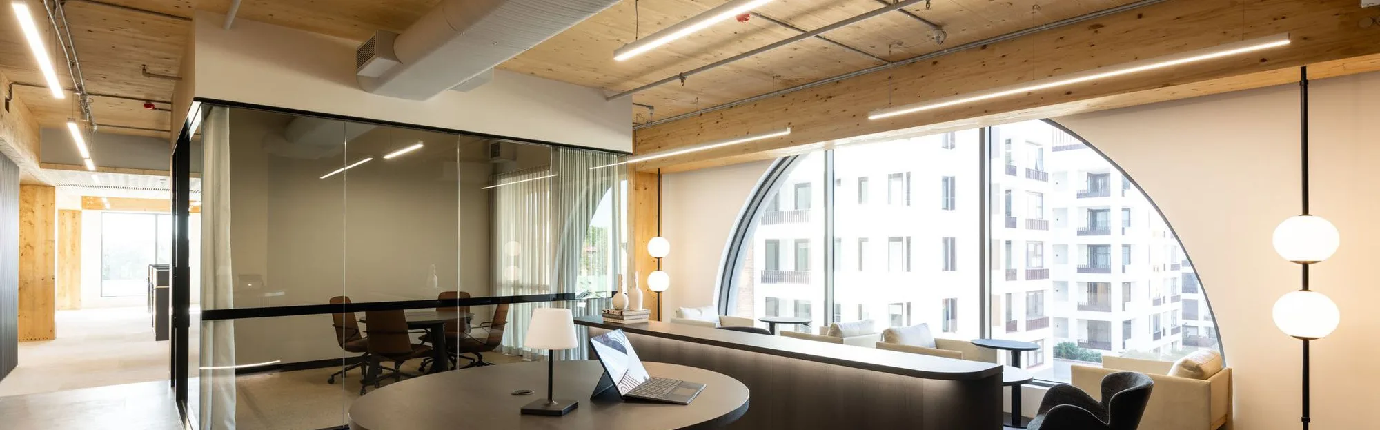 The Agency's Sydney office: an arched window, timber ceiling and the boardroom beyond